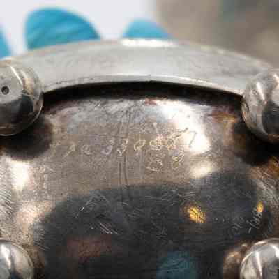 Engraving on bottom of gravy boat: The gravy boat has "TX" and illegiblenumbers engraved into the bottom.
