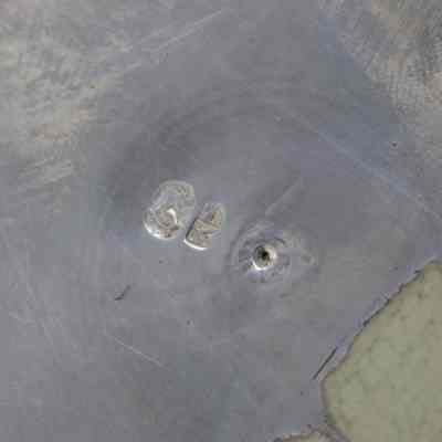 Stamp on back of plate: "GB" stamped into the back of the silver plate.
