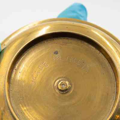 Bottom of ashtray: The bottom of the ashtray has, "Made in India," stamped into the bottom.