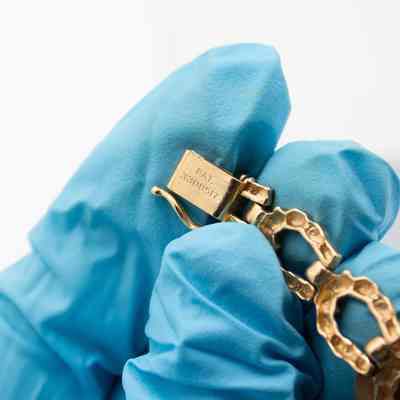 Close up of writing on clasp.: The clasp has “PAT. 3308517” engraved into it.