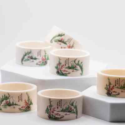 Set of Ivory Chinese Napkin Rings with Painted Garden Scene