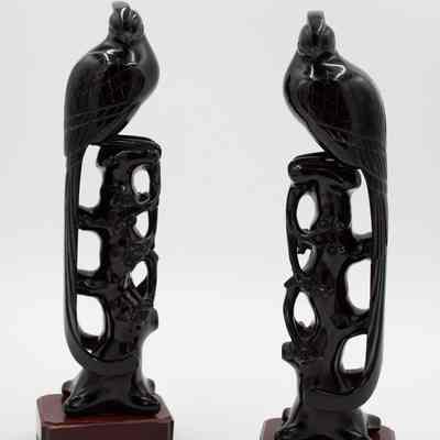Pair of Carved Red Amber Birds on Trees