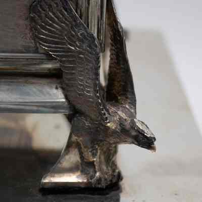 Kuwaiti falcon on the legs of the casket humidor.: Up close image of one of the legs of the casket humidor. It is a cast falcon.