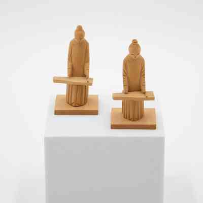 Pair of Small Carved Wooden Figurines of Men Playing Instruments
