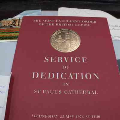 Items inside desk mat: A red program with "Service of Dedication in St Paul's Cathedral, Wednesday 22 May 1974 at 11.30."