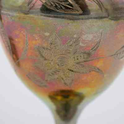 Flower engravings: The image displays a beautifully engraved scalloped brass vase with intricate floral designs.
