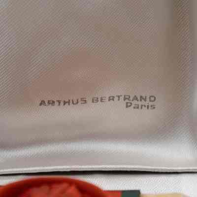 Inside of medal box: White lining in the box with "Arthus Bertrand; Paris."