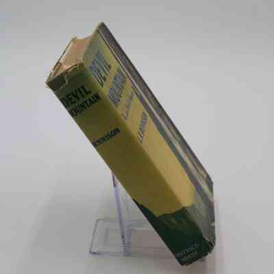 Spine of "Devil Mountain: The Lost World of Venezuela": The spine of "Devil Mountain: The Lost World of Venezuela," has the cover image wrap around with the words "Devil Mountain; Dennison; Hastings House" written in horizontal text.