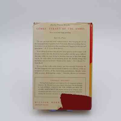 Back Cover of “Man of Glory - Simon Bolivar”: The back cover of “Man of Glory - Simon Bolivar” features excerpts from three reviews on the author's previous book about the former president of Venezuela, Juan Vicente Gómez. It also has a small biography on the author. There is a large tear in the bottom right corner of the back cover.