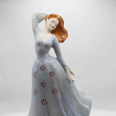 Porcelain Figurine in a Gray Dress with Red Flowers