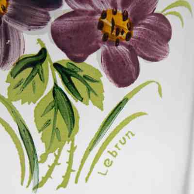 Lebrun signature on glass vase.: Up close image of the "Lebrun" signature at the bottom of the flower bouquet.