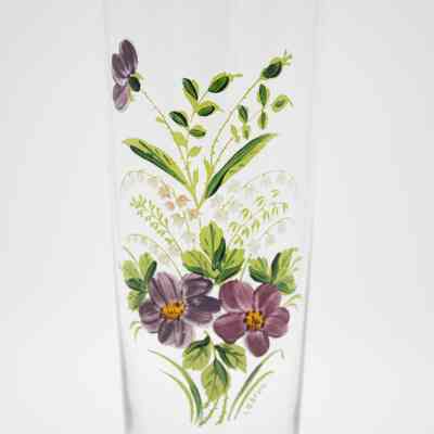 Glass Lebrun vase.: Up close image of a glass vase with gold foil edge and purple floral bouquet. There is a small signature at the bottom that reads "Lebrun."