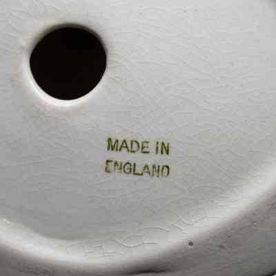 Stamp on bottom of figure: In gold text, "Made in England."