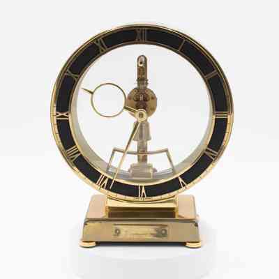 Gold and Black Open Clock with Roman Numerals and Visible Mechanisms
