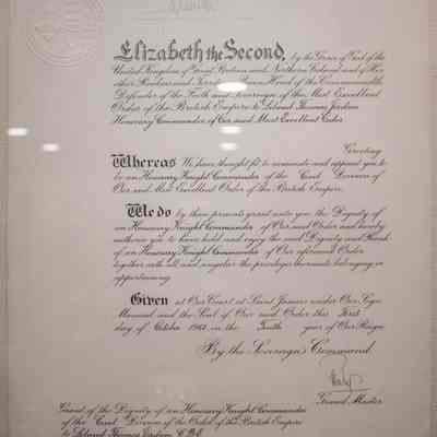 Certificate for LTJ Honorary Knight Commander of the Order of the British Empire: The image shows a ceremonial certificate appointing someone as an Honorary Knight Commander of the British Empire.