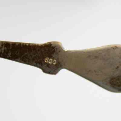 Back of the handle of one of the Kuwaiti coffee spoons.: Up close image of the back of the handle of one of the silver coffee spoons. It is stamped with "800."