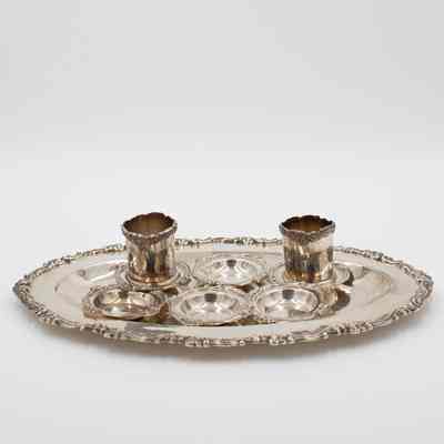 Silver Scroll-Edged Oval Salver, Cups, and Saucers