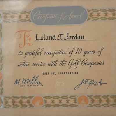 Close up of award details: In printed cursive, "Certificate of Award; To Leland T. Jordan in grateful recognition of 10 years of active service with the Gulf Companies."