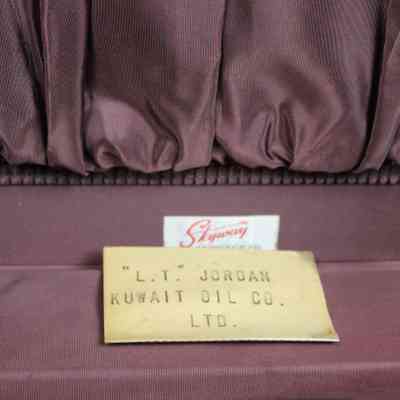 Name plaque inside suitcase: A brass rectangular plaque with ""L.T." Jordan; Kuwait Oil Co. LTD."