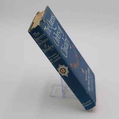 Spine of "The Queen's Orders of Chivalry": The spine features the title, author and publisher, William Kimber. It also features a second decorative medal.