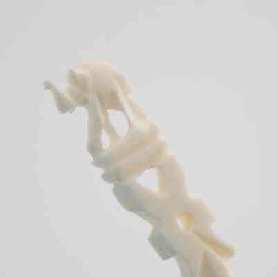 The end of one of the skewers.: Up close image of the end of one of the skewers. It depicts an elephant.
