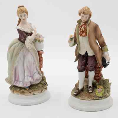 Pair of Ceramic Figurines of a Man and Woman in Colonial Dress