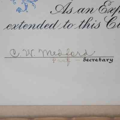 Secretary Signature: Close-up image of the location of where the Secretary of the Lufkin Rotary Club would sign. C.C. Medford is written in a faded ink. Also in faded ink is "Past-" next to the title of secretary.