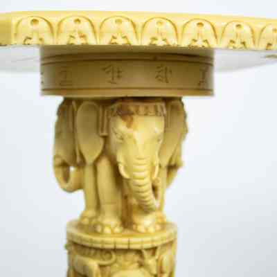 Elephants on pedestal: Carved elephants with headdresses in the pillar of the pedestal.