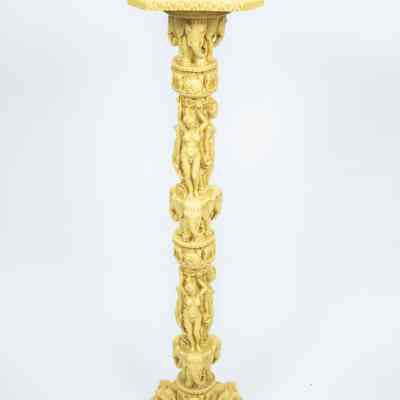 Pedestal pillar: The ivory pedestal features intricately carved goddesses, elephants, and dragons.
