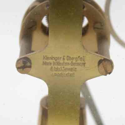 Engraved information on mechanisms: "Kieninger & Obergfell; Made in Western Germany, 6 jewels unadjusted."