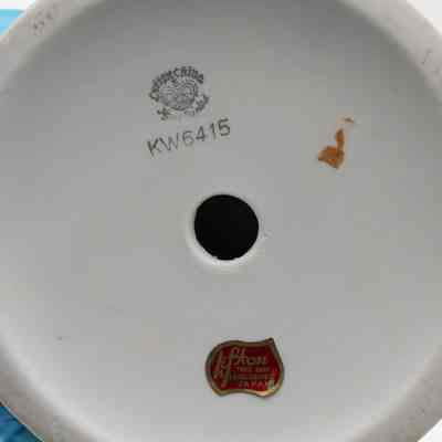 Bottom of one figure: The round white base has a printed logo, "Lefton China; Hand Painted," and "Lefton; trade mark; exclusives Japan." It has an item number, "KW6415."