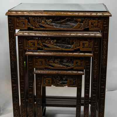Hong Kong nesting tables: The image shows intricately carved nesting tables from Hong Kong, with glass tops and detailed patterns, arranged in a set.