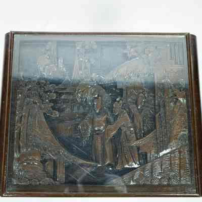 Hong Kong nesting table top: The image shows a carved nesting table from Hong Kong with an intricate wooden design under a glass top, depicting traditional scenes.