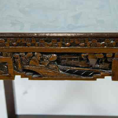Hong Kong nesting table side: The image showcases a beautifully carved nesting rectangular table from Hong Kong, featuring intricate designs and a glass top.