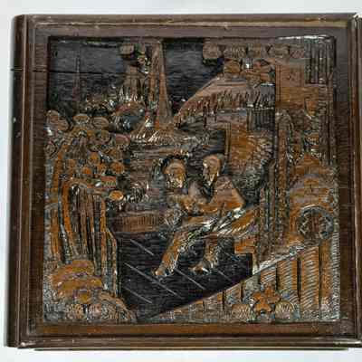Hong Kong nesting table top: The image shows a carved wooden nesting table set from Hong Kong, featuring intricate designs.