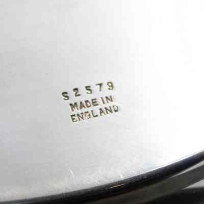 Stamp from silversmith on the back of the plate from Kuwait Masonic Lodge 6810.: Up close image of the embossed number and country of origin on the back of the plate. The number is "S2579" and reads "MADE IN ENGLAND."