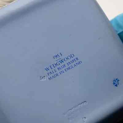 Back of Blue Wedgwood Jasperware square box.: Back of powder blue box has dark blue writing, "1953 WEDGWOOD PALE BLUE JASPER MADE IN ENGLAND."