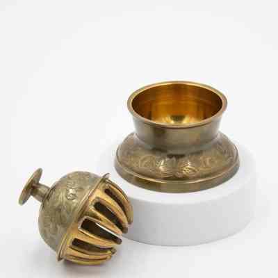 Meditation bell: A set of brass meditation bells featuring intricate leaf designs.