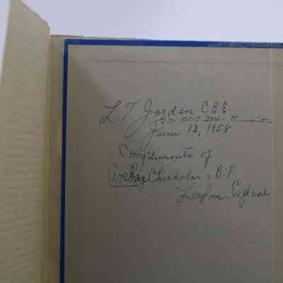 Handwritten note inside cover: The note inside states, "L.T. Jordan C.B.E. G.M. K.O.C Ltd. Kuwait- June 13, 1958. Compliments of Archie Chisholm, B.P. London, England."