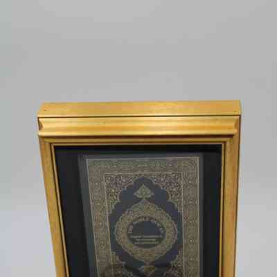 Blue and Gold Copy of "The Noble Quran" in Case and Gold Stand
