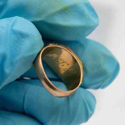 Inside of Jessie Wright Jordan's 1925 Lufkin High School class ring.: Up close image of the inside of Jessie's class ring. Engraved with her initials, "J.L.W."