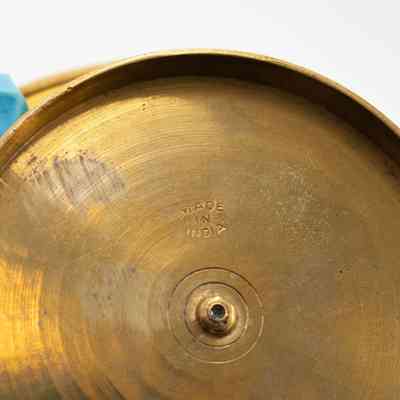 Base of ashtray: In the base of the ashtray, "Made in India" is stamped.