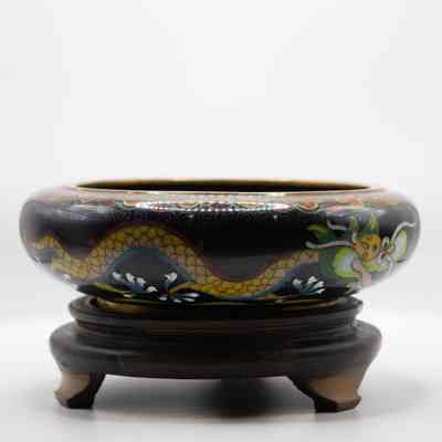Black enamel bowl with gold dragon on wood stand: The other side of the outside of the bowl shows a third dragon, practically identical to the one on the other side of the bowl and the one inside.