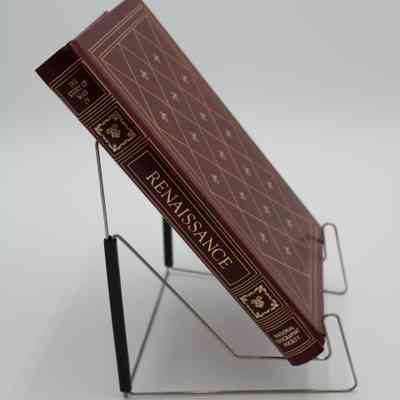 Book Spine: The spine of “Renaissance” is portioned off into 5 sections. The first section has the subtitle "The Story of Man IV", the second and fourth sections contain regal ornaments, the third is the title, and the fifth is for the creator, National Geographic Society. All of the details are colored gold.