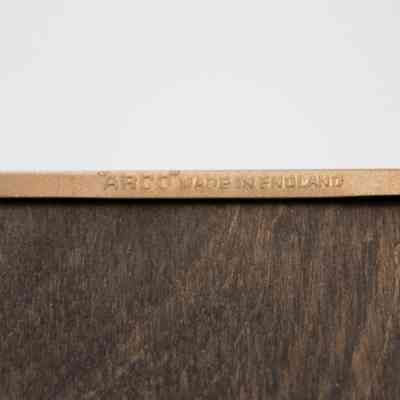 Frame Maker: Close-up image of the frame outline's back, showing a small impression that reads "'ARCO' Made in England."