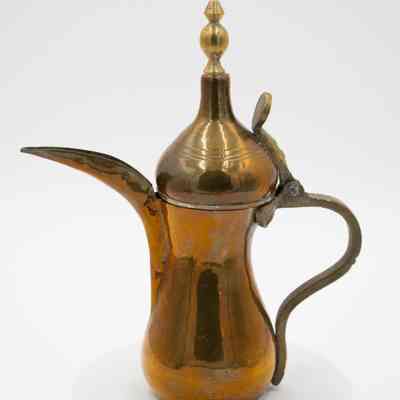 Brass coffee urn: The image shows a copper coffee urn with a brass finial.