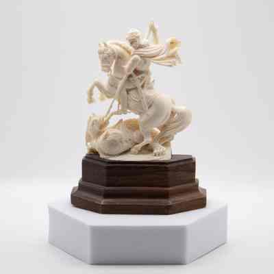 Carved Ivory Figurine of St. George Slaying the Dragon on Wooden Base