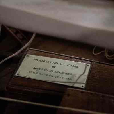 Plaque for L.T.J dedication: A silver plaque on the teakwood dhow, "Presented to Mr. L.T. Jordan by Arab Payroll Employees of K.O.C. LTD. on 29-9-1961."