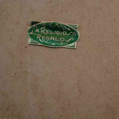 Back of award: A green sticker has the words, "La Religio A Regalo."