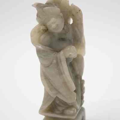 Man singing soapstone figurine.: One of two carved soapstone figurines. This one features a man singing.